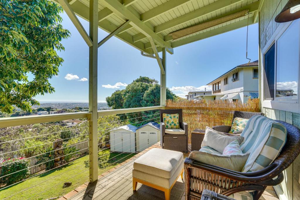 a porch with chairs and a balcony with a view at Inviting Aiea Bungalow with Balcony, Grill and Views! in Aiea