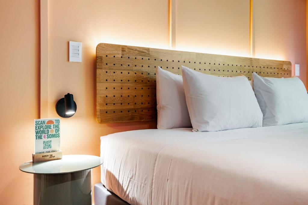 Cama o camas de una habitación en The Somos Central Hotel Poblado