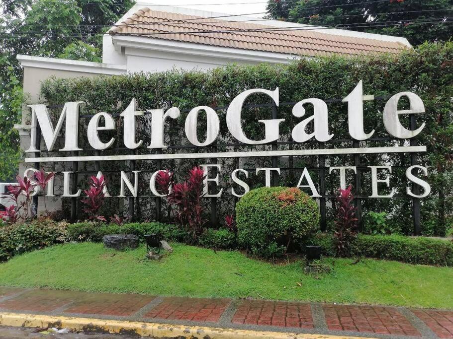 a sign for ametocaza marvelliatesemetery at Vacation homes metrogate estate in Silang