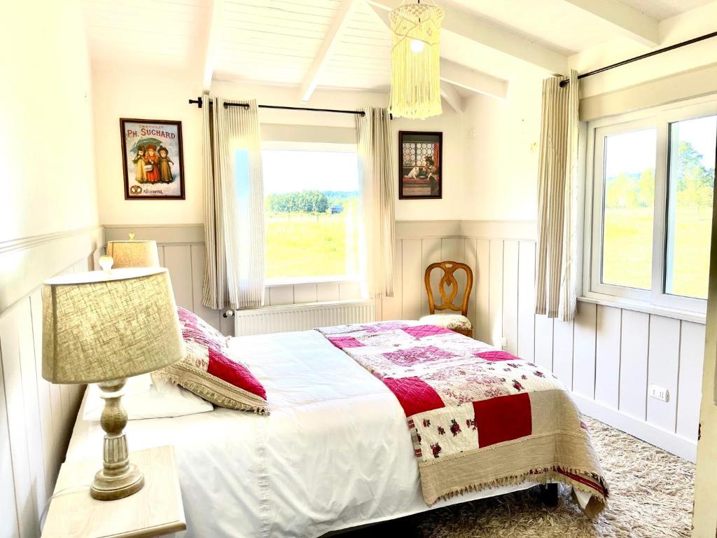 En eller flere senge i et værelse på Cabaña Vintage