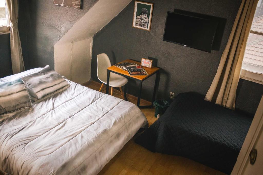 Voodi või voodid majutusasutuse Hostal Salvador toas