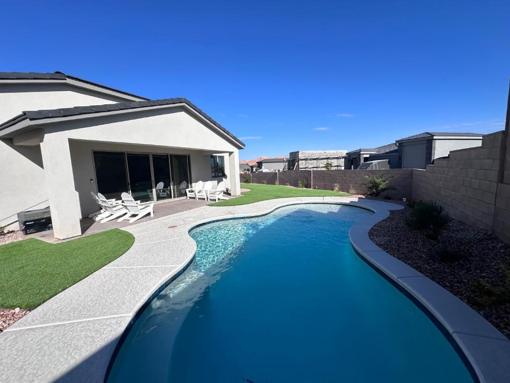 a swimming pool in the backyard of a house at Desert Gem - Mesquite in Mesquite