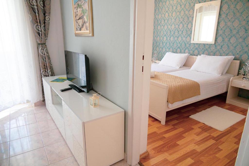 TV a/nebo společenská místnost v ubytování Apartment Kali 14116c
