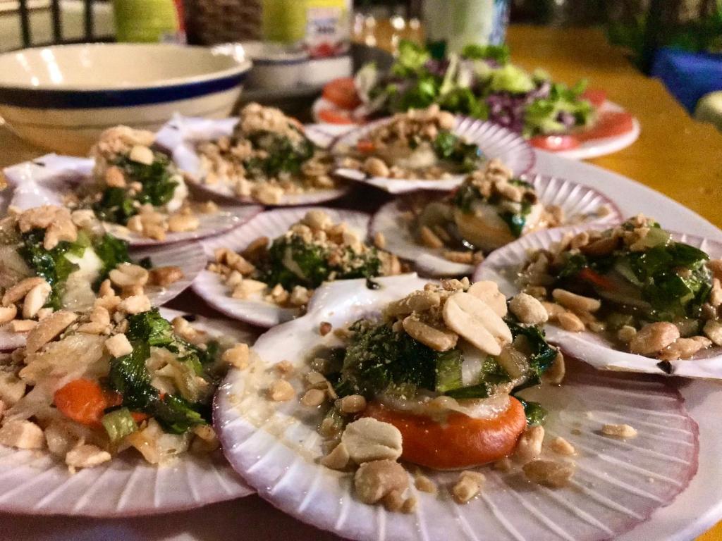 a bunch of food on a plate on a table at Eden House & Coffee Con Dao in Con Dao