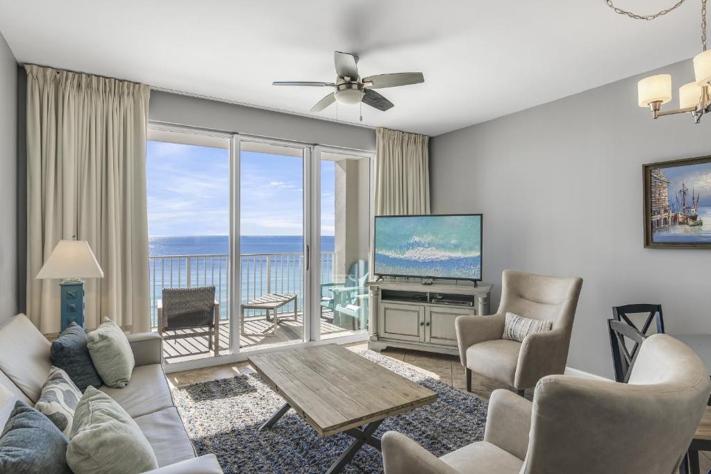 a living room with a view of the ocean at Majestic Sun Resort by Tufan in Destin