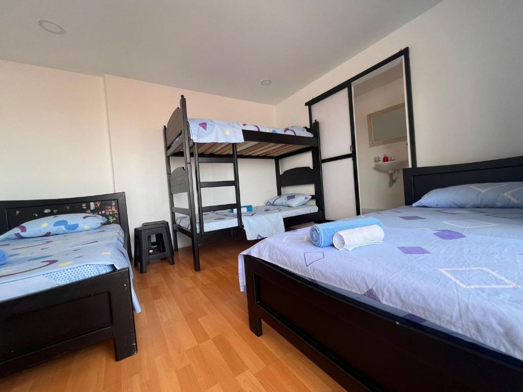 Postel nebo postele na pokoji v ubytování Epifania Hostel