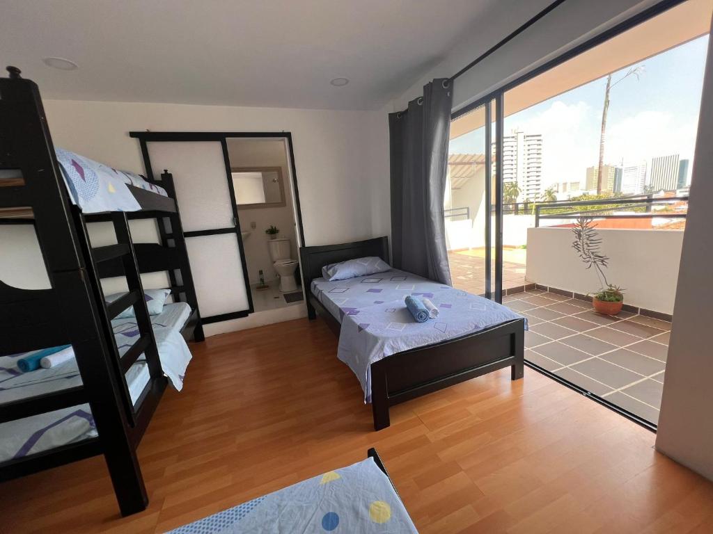 Postel nebo postele na pokoji v ubytování Epifania Hostel