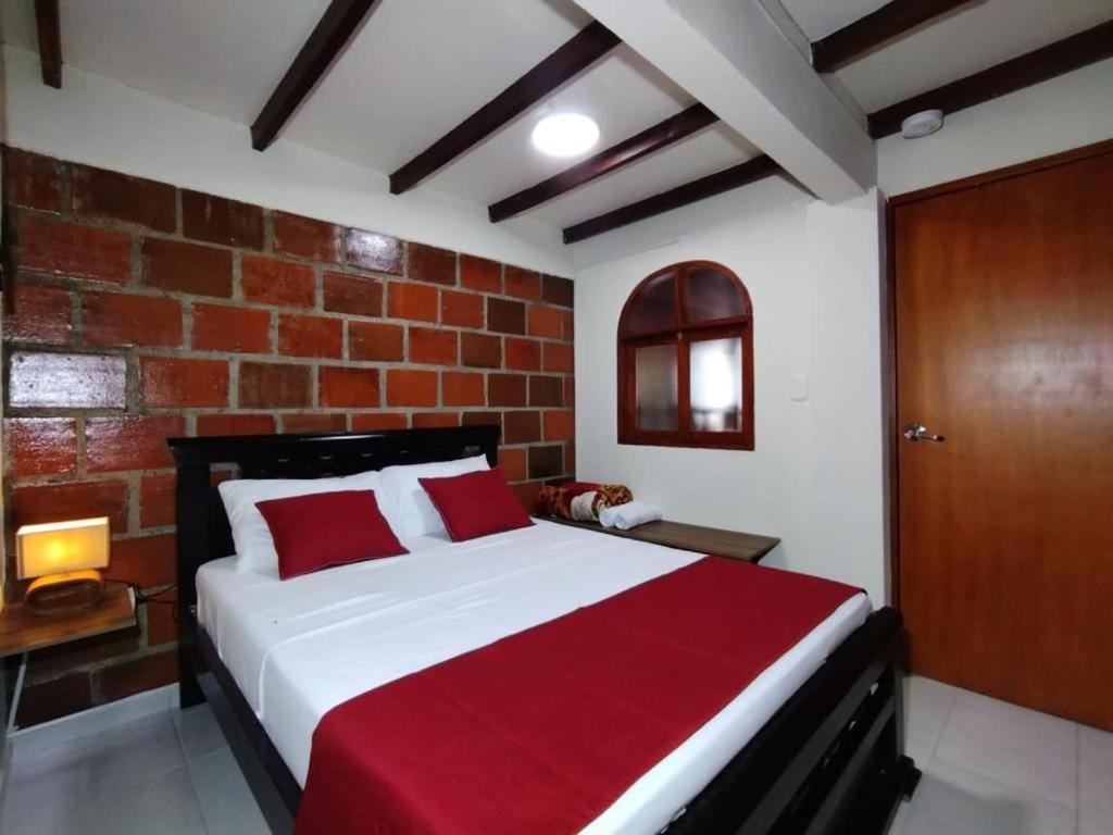 A bed or beds in a room at Hotel Colinas Del Darien