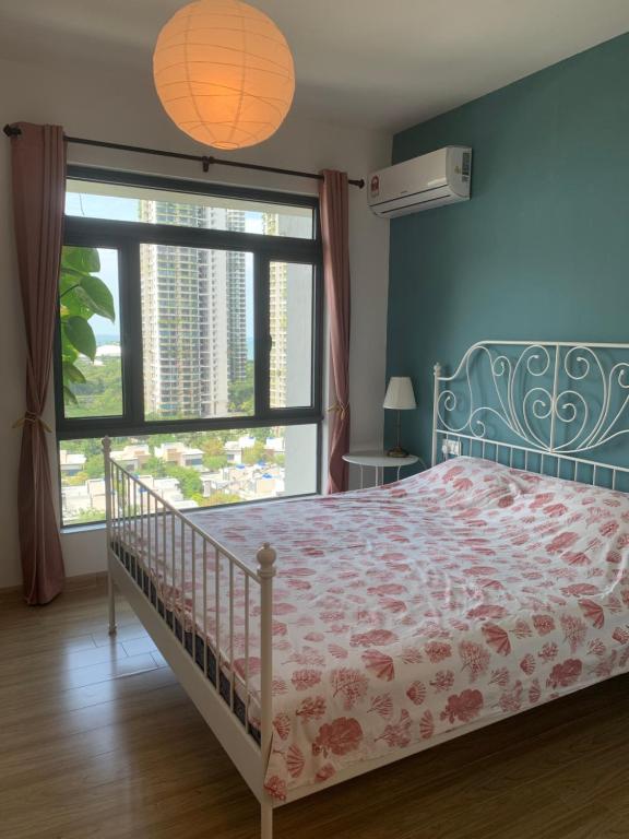 a bedroom with a bed and a large window at Sea view 2 bedroom Fully furnished Apartment Forest City Starview Bay Johor Malaysia in Kampong Pok Kechil