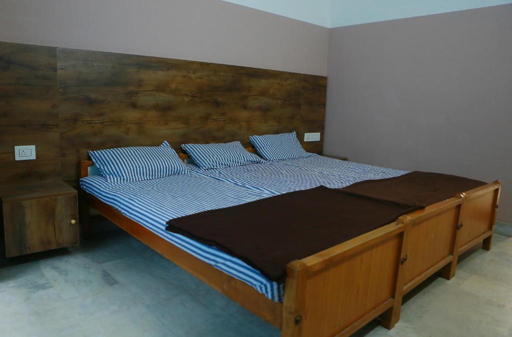 Postel nebo postele na pokoji v ubytování Chakalakkal Residency