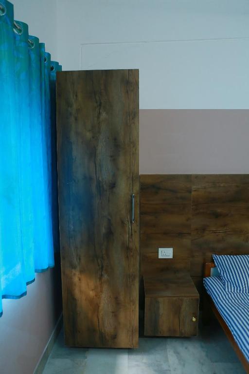 Postel nebo postele na pokoji v ubytování Chakalakkal Residency