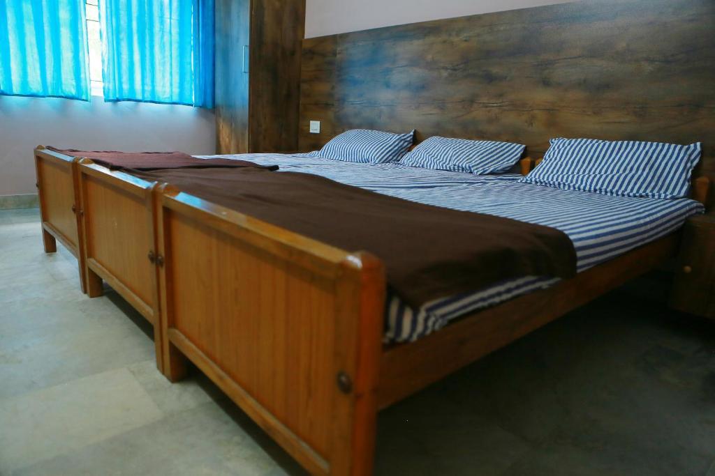 Postel nebo postele na pokoji v ubytování Chakalakkal Residency