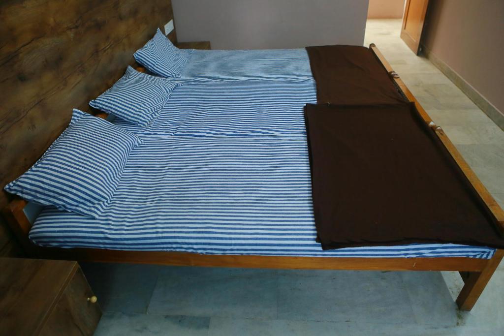 Postel nebo postele na pokoji v ubytování Chakalakkal Residency