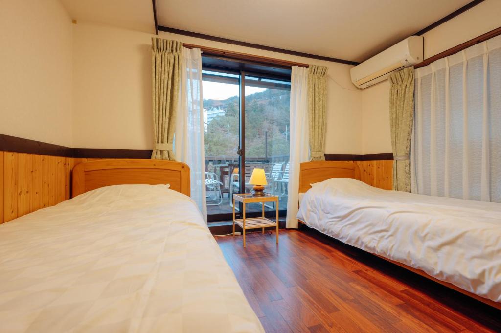 Postel nebo postele na pokoji v ubytování Hotel Morgenrot