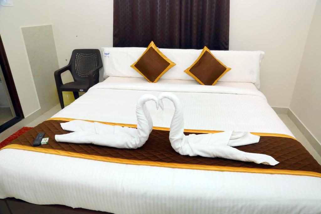 Postel nebo postele na pokoji v ubytování Hotel Elite Inn