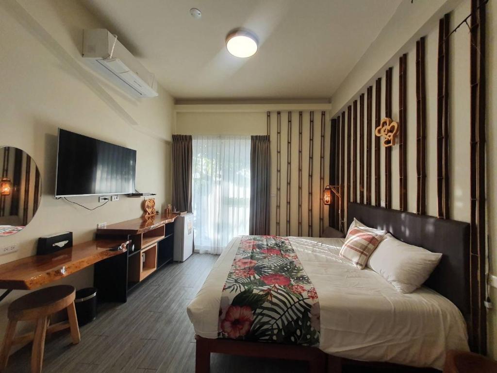 TV a/nebo společenská místnost v ubytování Inn巷文創旅店 Inn siang B&B-墾丁夢幻島
