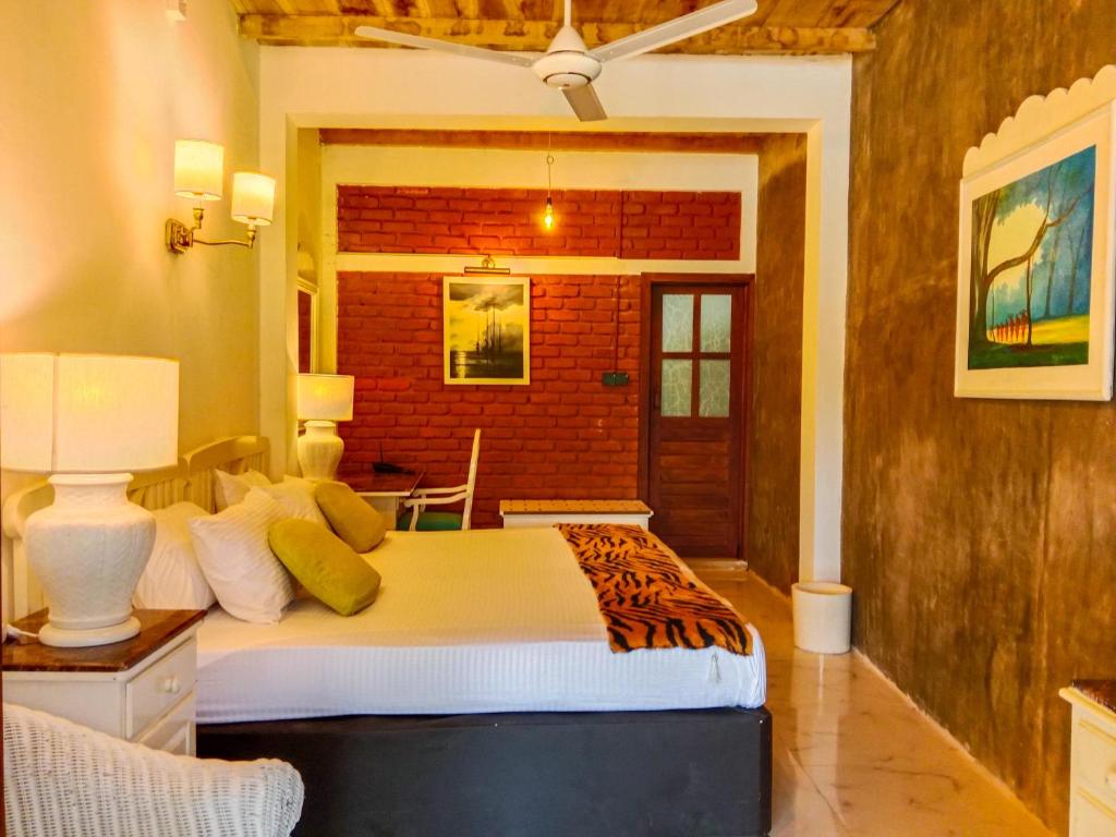 Postel nebo postele na pokoji v ubytování Sigiriya Elegant Resort