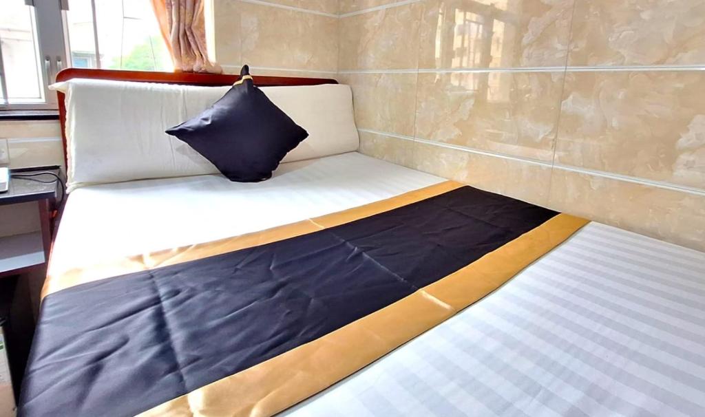 Postel nebo postele na pokoji v ubytování International Metro Guest House