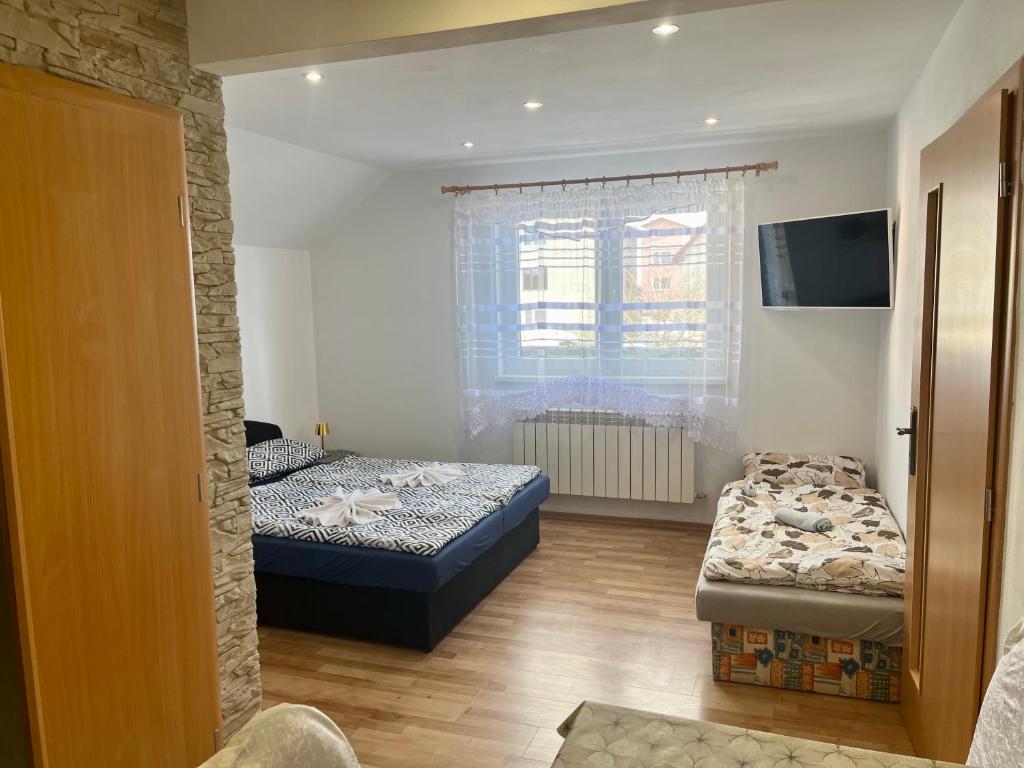 Postel nebo postele na pokoji v ubytování Homestay Renata