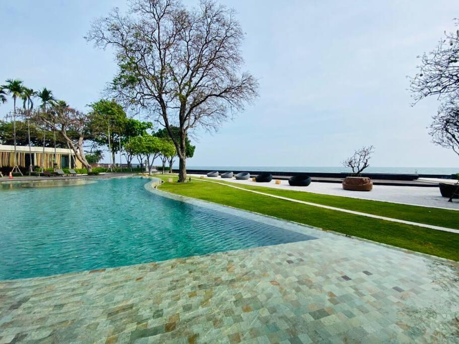 a pool of water with a tree in the middle at 2 Bedroom oceanfront condo in Hua Hin