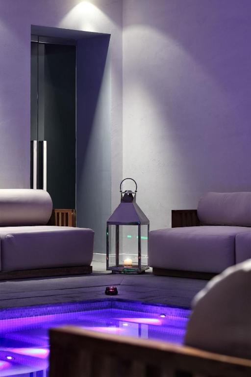 a lantern sitting on the floor with purple lights at La Suite Boutique Hotel in Procida