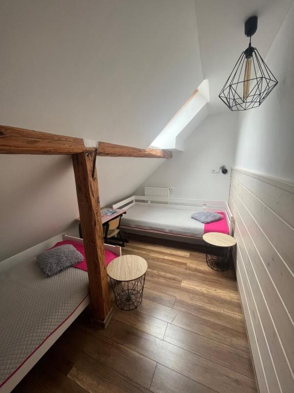 Postel nebo postele na pokoji v ubytování Apartamenty Kadłubek