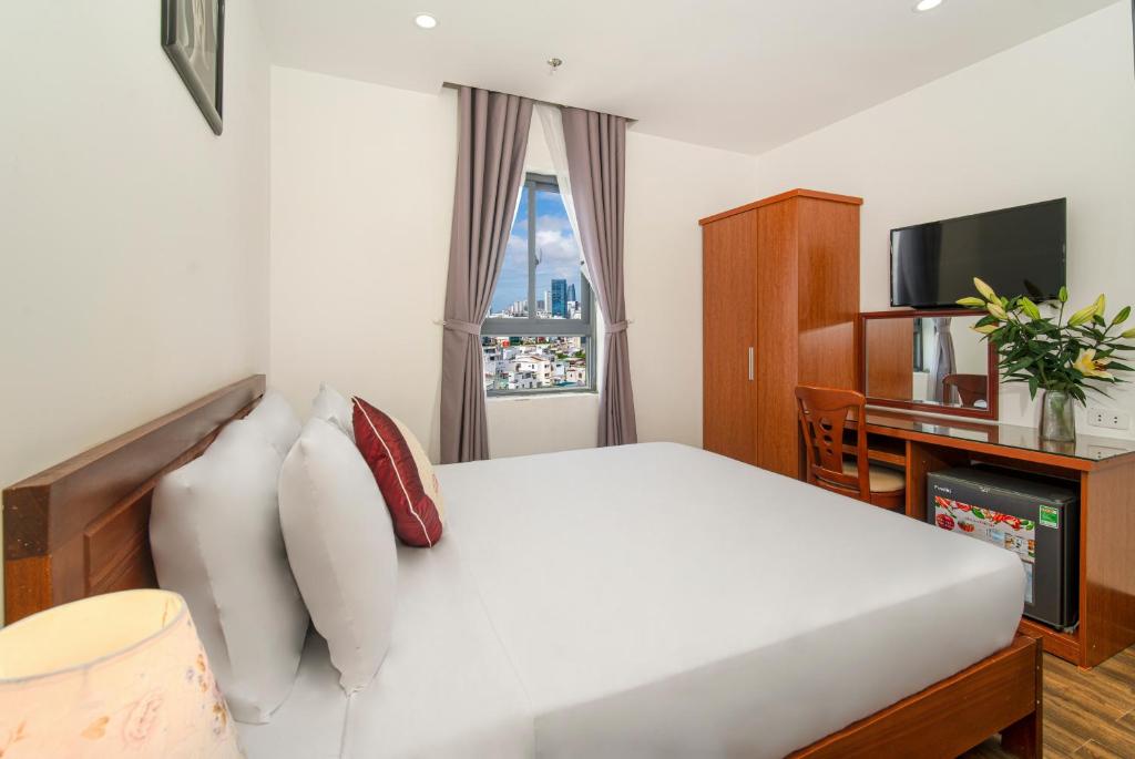 Postel nebo postele na pokoji v ubytování Phú An Hotel