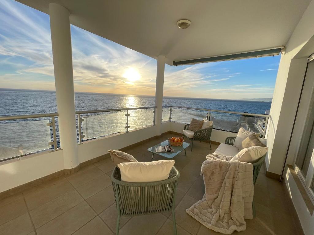 a balcony with a view of the ocean at Casa Pepita by the sea in Torrenueva