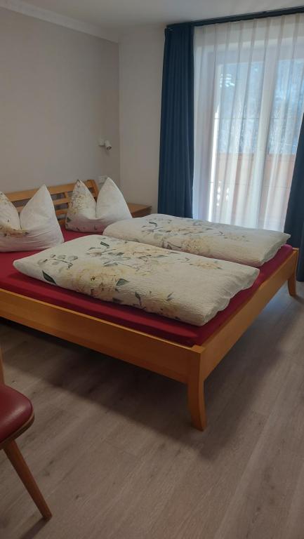 A bed or beds in a room at Haus Talblick