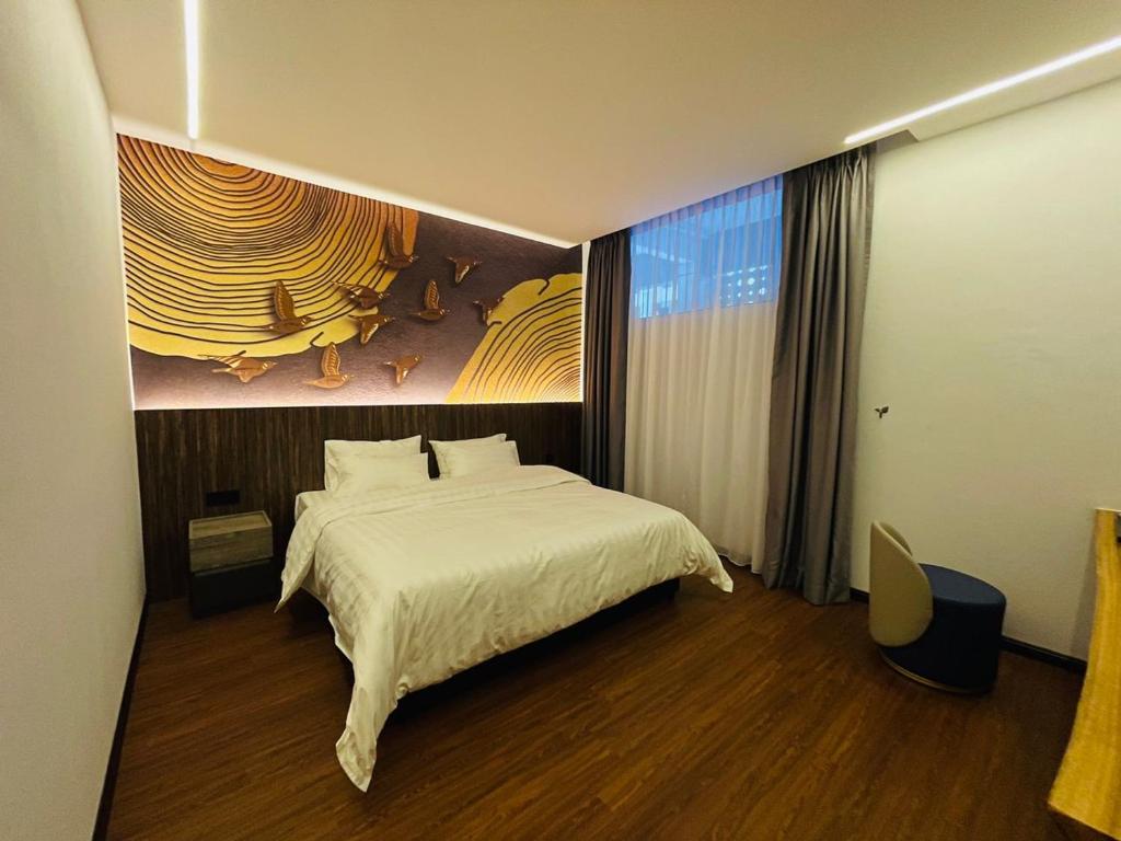 Ένα ή περισσότερα κρεβάτια σε δωμάτιο στο Cyther Stay Hotel