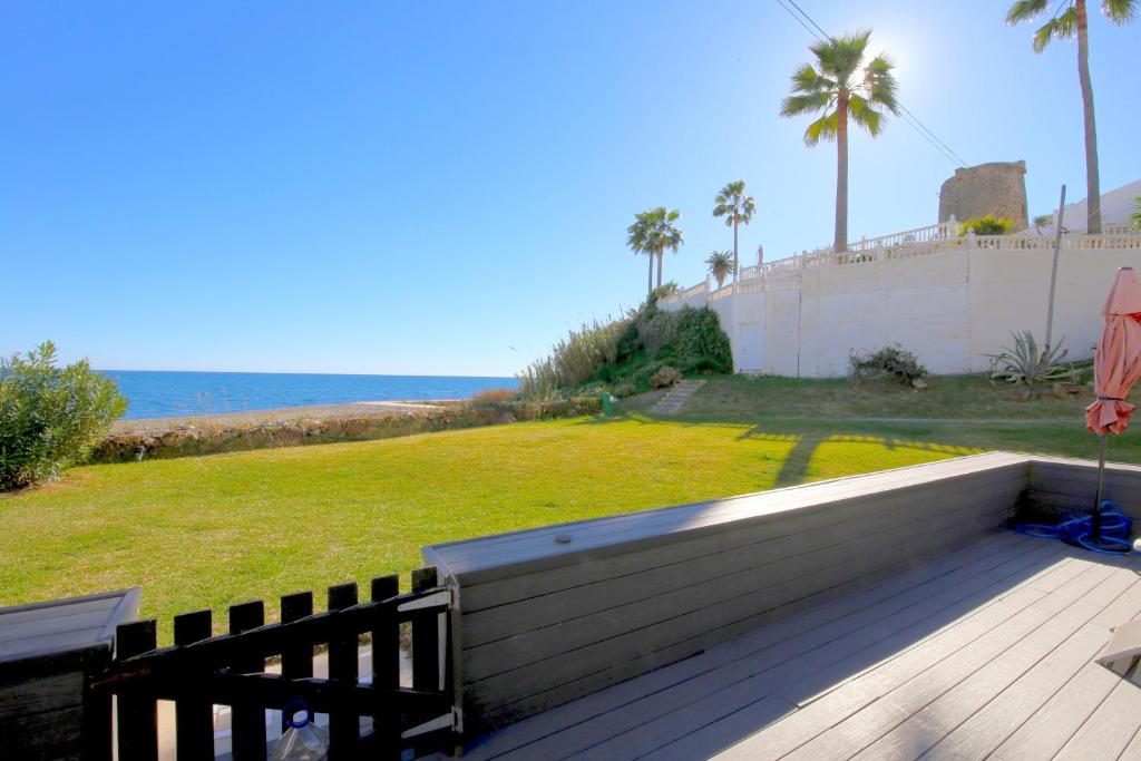 a wooden deck with a view of the ocean at Townhouse SEASCAPE in Estepona