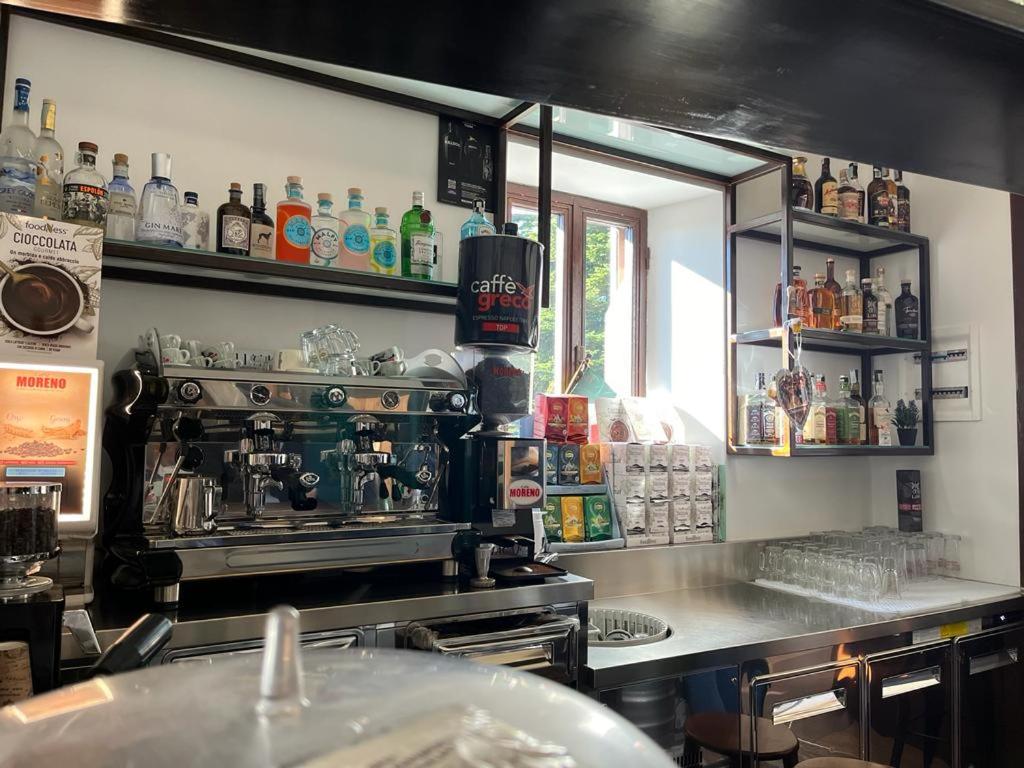 a kitchen with a stove and a counter with alcohol at DOMUS VELA in Fornelli