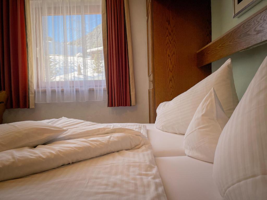 Postel nebo postele na pokoji v ubytování Hotel Tenne