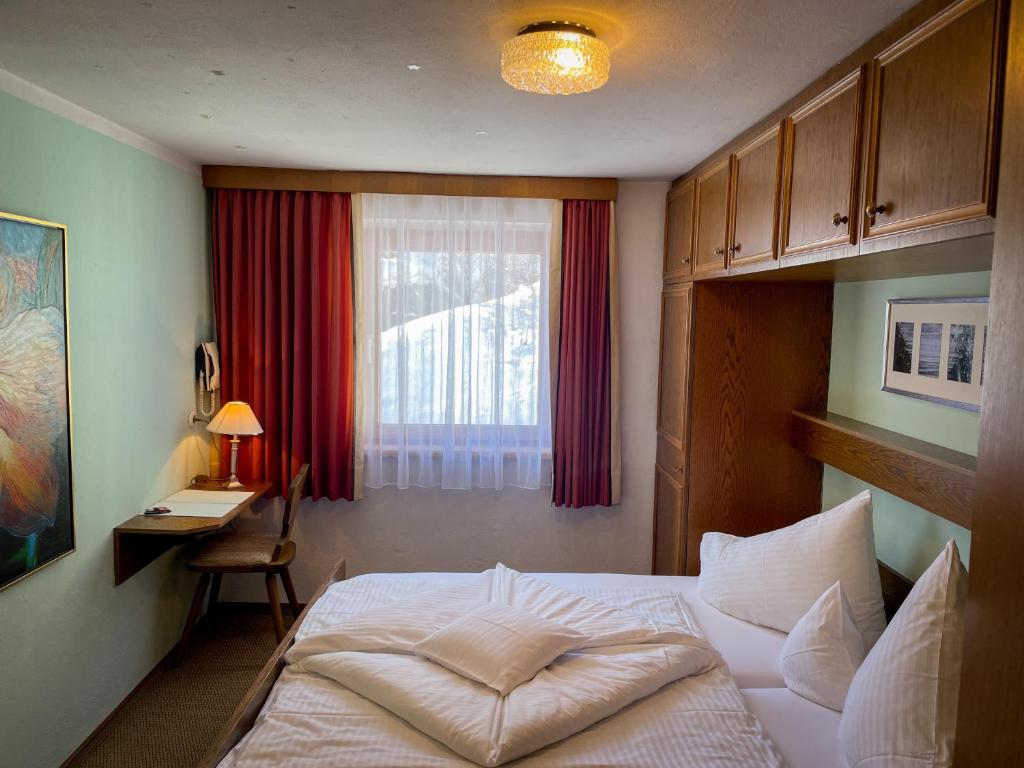 Postel nebo postele na pokoji v ubytování Hotel Tenne