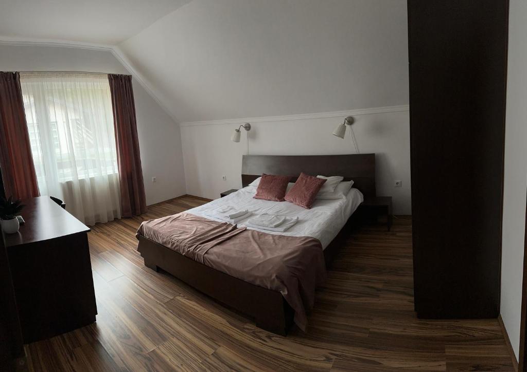 Postel nebo postele na pokoji v ubytování Vila Man