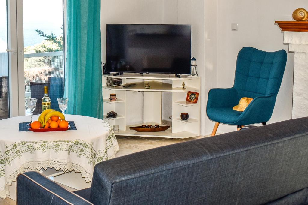 Телевизор и/или развлекательный центр в Nest View House