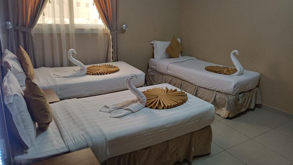 Cama o camas de una habitación en Razana Al-Hafaer