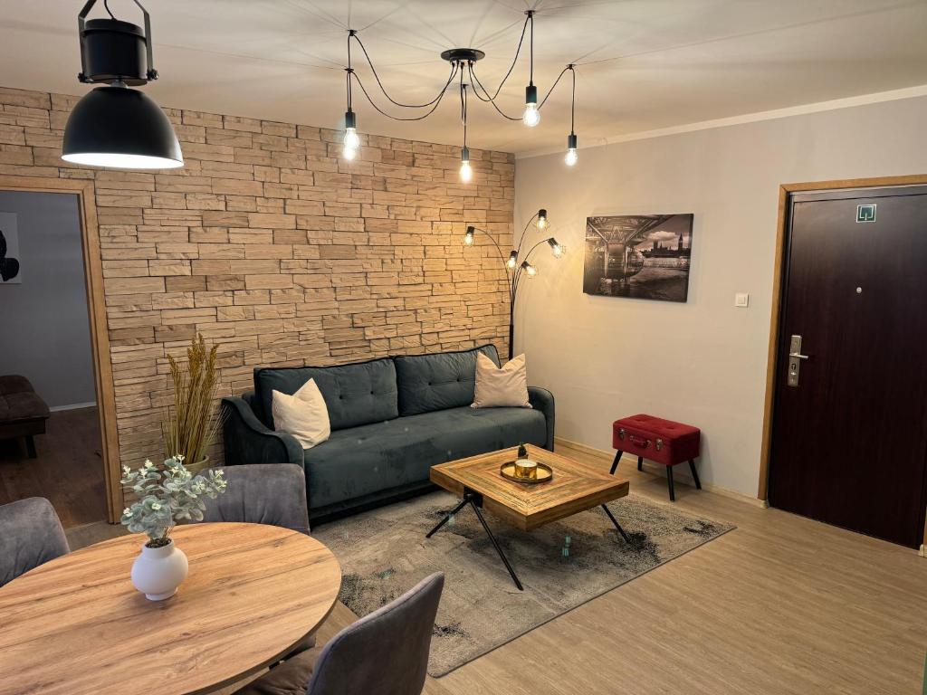 a living room with a couch and a table at Four Seasons in Rijeka