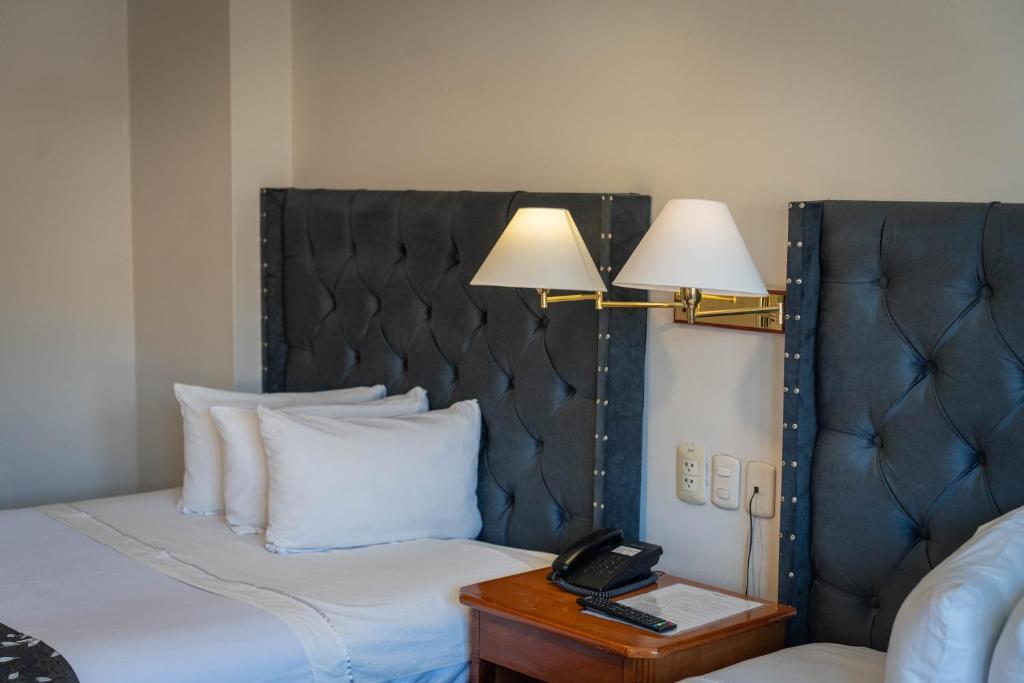 Cama o camas de una habitación en Casona Plaza Hotel Puno