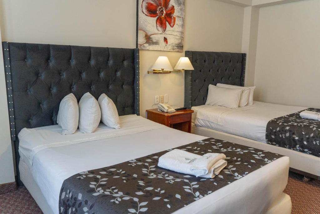 Cama o camas de una habitación en Casona Plaza Hotel Puno