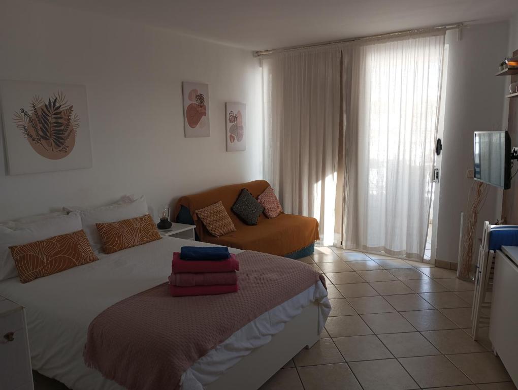 Łóżko lub łóżka w pokoju w obiekcie Apartamento Te Miti