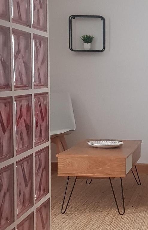 a room with a table and a mirror at Catedral Centro- 4 plazas in Burgos