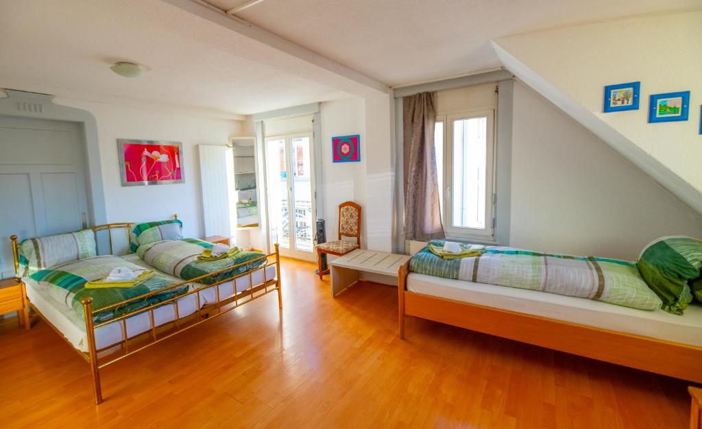 Postel nebo postele na pokoji v ubytování Residence Villa Flora
