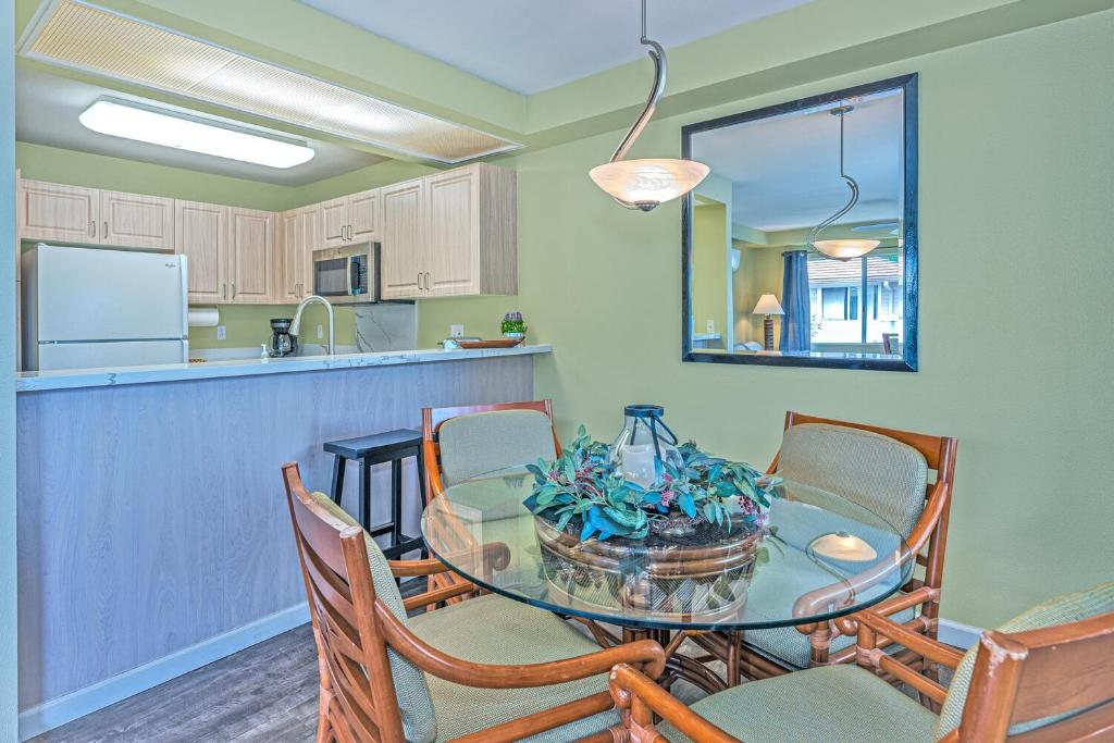 a kitchen and dining room with a table and chairs at Ko Olina Fairways #4E townhouse in Kapolei