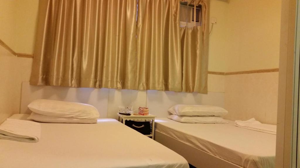 Voodi või voodid majutusasutuse Li Cheng Guesthouse toas