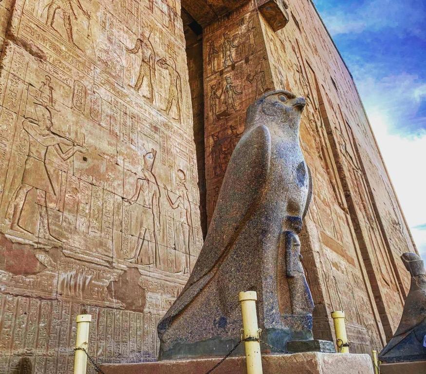 a statue of anubis standing in front of anaraoh at Nile Cruise Every Monday 4 Nights from Luxor to Aswan in Luxor