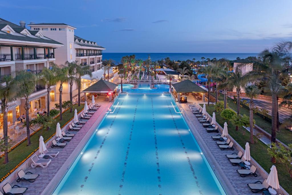 an overhead view of a swimming pool at a resort at Dobedan Beach Resort Comfort ''Ex Brand Alva Donna Beach Resort Comfort'' in Side