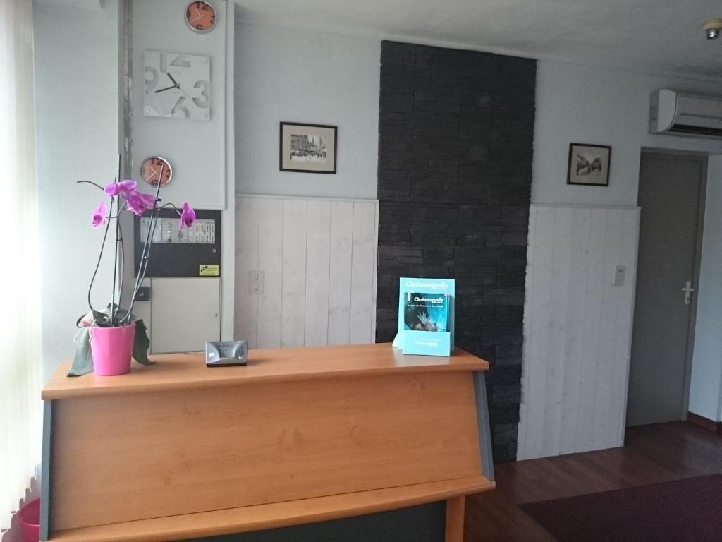 a desk with a blue box on top of it at Hotel TGV in Quimper