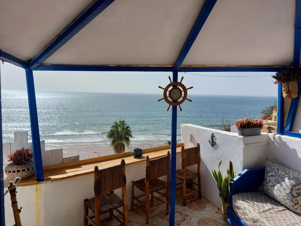 a view of the ocean from a gazebo at Asala Guest House in Taghazout