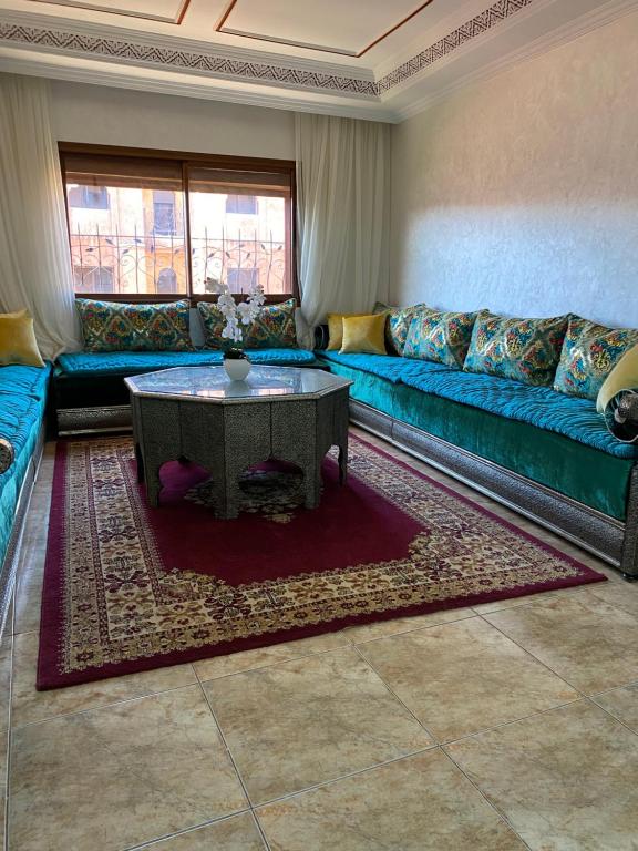 a living room with a couch and a table at Lala's apartment in Marrakesh